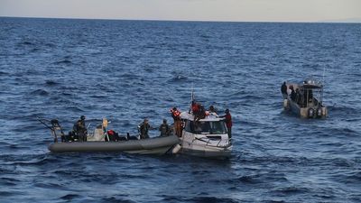 Australian military personnel rescue occupants of stricken Solomon Islands police boat