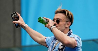 Jack Grealish steals show during Man City parade as he glugs beer and mocks teammates