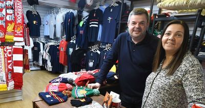 Reds fans snap up Paris final T-shirts from Anfield's famous Hat, Scarf or a Badge shop