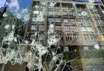 Russia pounds Ukraine's east as town buries dead in mass grave