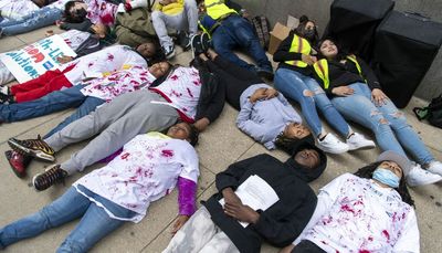 Young people stage ‘die in’ outside City Hall calling for more youth resources to prevent gun violence