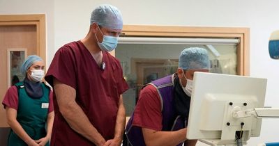 Prince William dons scrubs as he visits hospital to learn about new cancer treatments