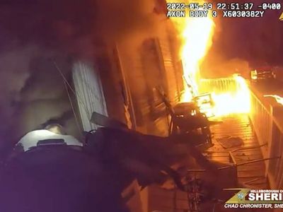Terrifying moment sheriff’s deputies rescue nine-year-old boy from burning home
