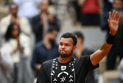 Tsonga says tearful farewell after French Open defeat