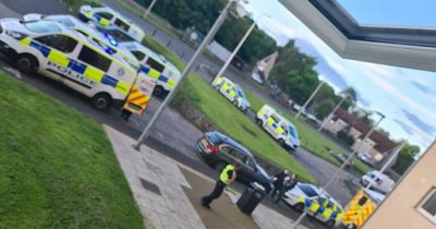Police race to scene of 'incident' at Scots high rise flats with man seriously injured