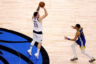 Doncic helps Mavs down Warriors to keep series alive