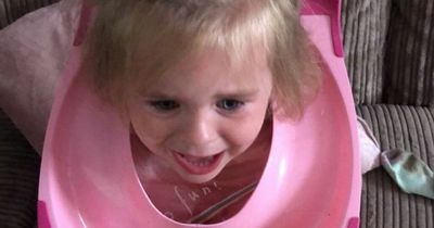 Mum had to keep tipping daughter to get rainwater out of toilet seat on her head