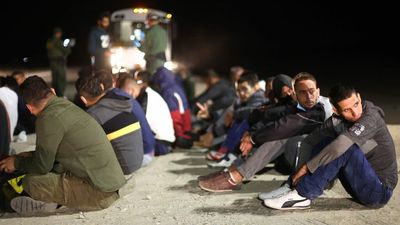 Scoop: Tens of thousands of migrants waiting on U.S. doorstep