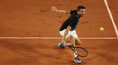 Simon Draws Inspiration from Tsonga in Grueling French Open Win
