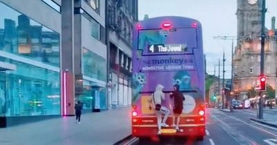 Edinburgh youths filmed dangerously riding on back of bus along Princes Street