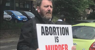 Anti-abortion protestors at Scots health clinic hold sickening signs