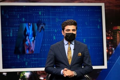 Afghan male TV presenters wear masks in protest against Taliban
