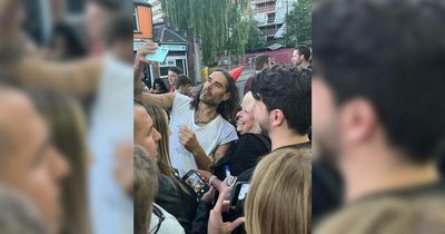 Russell Brand mobbed by fans in Merseyside as woman bursts into tears