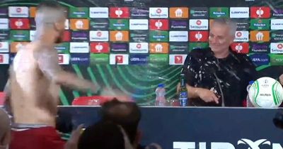 Jose Mourinho soaked by Roma players as they stormed press conference in celebration