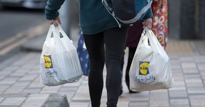 Lidl worker punched in face in row over carrier bags as regular customer helps herself