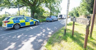 Police launch murder probe after woman found dead by dog walker on country lane