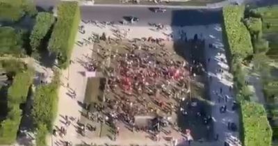 Liverpool fans heard singing from top of Eiffel Tower