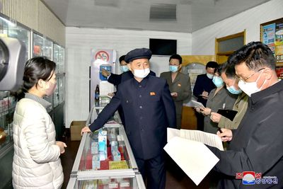 N.Korea says new fever cases under 100,000 as virus fight heats up