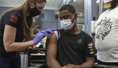 Disparities in COVID-19 vaccinations cost 255 lives in Chicago last year