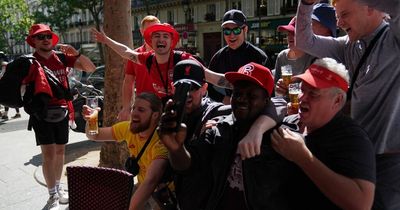 Liverpool FC fans party on streets of Paris as riot police keep 'watchful eye'