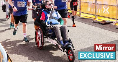 Hero athlete on ventilator and unable to move completes TRIATHLON in wheelchair