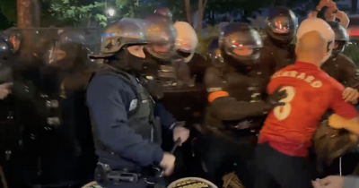 Liverpool fans attacked by riot police watching Champions League final in Paris fan zone