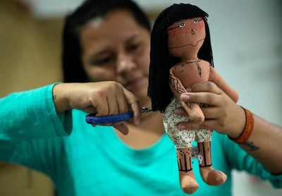 A doll brings pride, identity for Brazil Indigenous woman