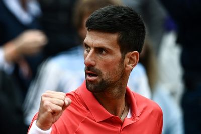 Djokovic says being No. 1 'best and worst' after reaching quarters