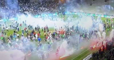 St Etienne stars race up tunnel to escape their OWN firework throwing fans as chaos erupts after relegation