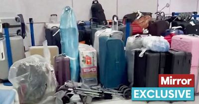 Hundreds of suitcases abandoned at UK airport as TUI customers wait 'over FIVE HOURS'