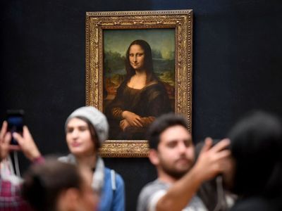 Mona Lisa: Climate change protester ‘tries to attack painting with cake while disguised as elderly woman’