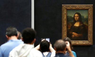Man arrested after smearing Mona Lisa with cake at Louvre