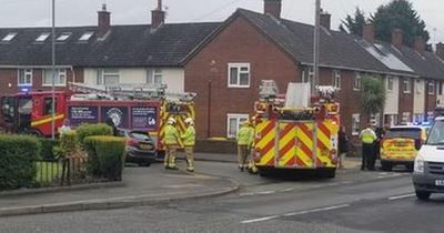 Woman trapped in car as police close road after crash