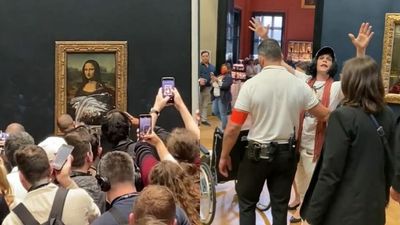 Mona Lisa Was, How You Say, Vandaliséd By A French Man Disguised As An Old Woman With Cake