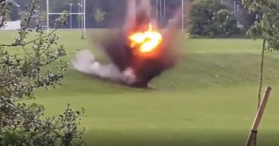 Boys play football metres away from 'controlled explosion'