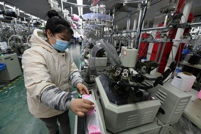 China manufacturing improves as virus curbs eased