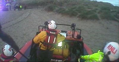 Family got stuck in mud and cut off from beach as tide comes in