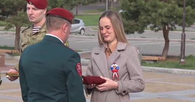 Russian widow breaks down receiving award for husband as military deaths reach 30,000