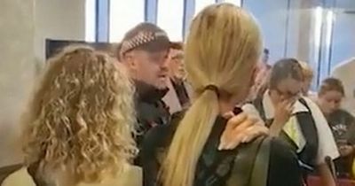 "It's been cancelled, you're not going on holiday": Shocking moment POLICE tell furious passengers at Manchester Airport their TUI trip is cancelled