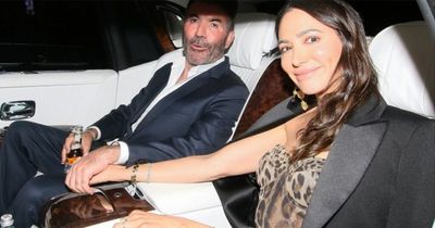 Simon Cowell's fiancée Lauren Silverman flashes huge engagement ring as they leave BGT