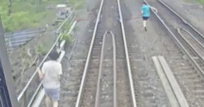 Heart-stopping moment children trespassing on train tracks escape death by seconds