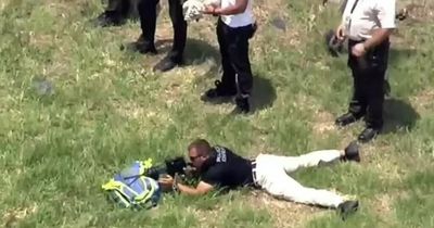 Snipers aim at alligator-infested pond as mum and son are rescued from waters
