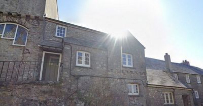 The 400-year-old cottage in the shadow of a famous castle with its own dungeon