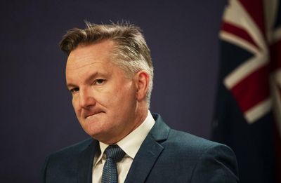 Labor will cut EV taxes and try to legislate 2030 emissions target, Chris Bowen says