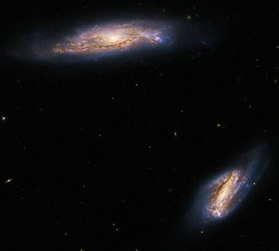 Double trouble: Hubble telescope spies galaxy pair flaunting their sprawling arms