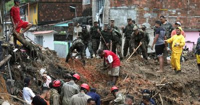 At least 91 dead and 26 missing after floods tear through Brazil shanty towns