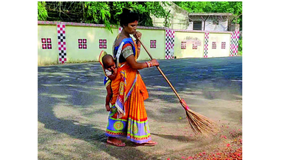 Orissa: Toddler tied to back, woman sweeps streets of Baripada