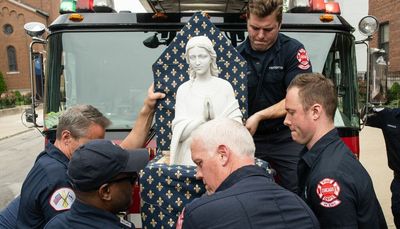 Statue honoring victims of Our Lady of the Angels fire returns to site of blaze