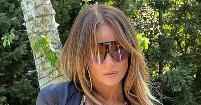Jennifer Lopez shows off stunning figure in black bikini and Versace sunglasses