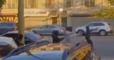 Dramatic footage shows rival gang members shooting at each other in broad daylight